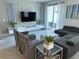 Well-decorated living space features a large TV, comfortable seating, and bright, natural light at 8934 Stinger Dr, Davenport, FL 33896