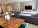 Open-concept living space with elegant dining table and cozy seating area for guests at 8934 Stinger Dr, Davenport, FL 33896