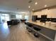 Spacious open-plan with modern kitchen, dining area, and comfortable living area for entertaining at 8934 Stinger Dr, Davenport, FL 33896