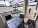 Enclosed pool area with outdoor seating and privacy fence at 8934 Stinger Dr, Davenport, FL 33896