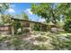 Spacious backyard featuring mature trees, providing ample shade at 905 Flewelling Ave, Ocoee, FL 34761