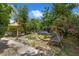 Outdoor living space with comfortable seating and lush landscaping at 905 Flewelling Ave, Ocoee, FL 34761