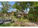 Spacious backyard featuring mature trees, providing ample shade at 905 Flewelling Ave, Ocoee, FL 34761