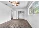 Bright bedroom with a ceiling fan and a closet that offers ample storage space for an organized living experience at 905 Flewelling Ave, Ocoee, FL 34761