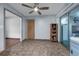 Dining room features tile flooring, a ceiling fan and sliding door to an enclosed porch at 905 Flewelling Ave, Ocoee, FL 34761