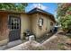 Exterior view that shows the home’s functional door and yard; a practical space ready for your personal touch at 905 Flewelling Ave, Ocoee, FL 34761