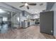 Cozy kitchen features grey cabinets, tile floors, and a stainless steel refrigerator at 905 Flewelling Ave, Ocoee, FL 34761