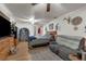 Spacious main bedroom with hardwood flooring, ceiling fan and seating at 905 Flewelling Ave, Ocoee, FL 34761