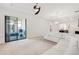 View of living room with sliding glass doors leading to an outdoor patio area at 9188 Chandler Dr, Groveland, FL 34736