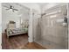 Bright bedroom boasts ensuite bathroom with glass shower and views of bedroom at 922 Grazie Loop, Davenport, FL 33837