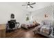 Charming bedroom featuring twin beds, a fun polka dot wall, and wood-look floors at 922 Grazie Loop, Davenport, FL 33837