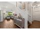 Inviting entryway with elegant decor, a staircase leading to the upper level, and a glimpse into the spacious living area at 922 Grazie Loop, Davenport, FL 33837