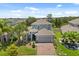 Beautiful two-story home featuring a well-maintained lawn, mature landscaping, and an attached two-car garage at 922 Grazie Loop, Davenport, FL 33837