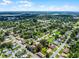 Scenic aerial view of a home nestled in a vibrant neighborhood surrounded by lush green landscapes at 1011 W 13Th St, Lakeland, FL 33805