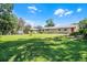 Expansive backyard featuring lush green grass and plenty of space for outdoor activities and gardening at 1011 W 13Th St, Lakeland, FL 33805