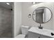Updated bathroom featuring a new vanity, sink, toilet, and tiled walk-in shower at 1011 W 13Th St, Lakeland, FL 33805