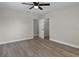 Neutral bedroom featuring modern flooring, a ceiling fan, and closet storage at 1011 W 13Th St, Lakeland, FL 33805