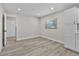 Dining room with new luxury vinyl plank flooring, fresh paint, and natural light from the window at 1011 W 13Th St, Lakeland, FL 33805