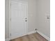 Entryway featuring laminate flooring and access to the laundry hook-ups at 1011 W 13Th St, Lakeland, FL 33805