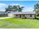 Charming single-story home features a well-maintained lawn, brick facade, and attached garage at 1011 W 13Th St, Lakeland, FL 33805