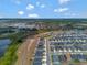Wide aerial view of community with homes, parks, and nearby natural spaces at 1159 Mountain Flower Ln, Davenport, FL 33837