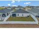 Aerial view of the home's fenced backyard and neighborhood at 1159 Mountain Flower Ln, Davenport, FL 33837