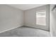 Neutral bedroom with soft carpet, window with blinds and modern decor at 1159 Mountain Flower Ln, Davenport, FL 33837