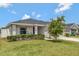 Well-maintained lawn and manicured shrubs surround this beautiful home at 1159 Mountain Flower Ln, Davenport, FL 33837