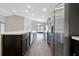 Modern kitchen with stainless steel appliances and dark wood cabinets at 1159 Mountain Flower Ln, Davenport, FL 33837