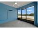 Enclosed lanai features tile floor, ceiling fan, and expansive outdoor views at 1159 Mountain Flower Ln, Davenport, FL 33837