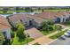 Stunning aerial view of home with golf course and pond at 13232 Alderley Dr, Orlando, FL 32832