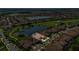 An aerial view shows the property with its manicured lawn located on a scenic golf course community at 13232 Alderley Dr, Orlando, FL 32832