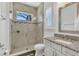 Modern bathroom with glass-enclosed shower and granite vanity top at 13232 Alderley Dr, Orlando, FL 32832