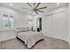 Comfortable bedroom featuring a cozy bed, large windows, and an ensuite bathroom at 13232 Alderley Dr, Orlando, FL 32832