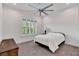 Cozy bedroom with soft carpet, neutral tones, and a window providing natural light at 13232 Alderley Dr, Orlando, FL 32832