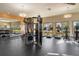 Bright gym area with treadmills, weight machines, and mirrored walls at 13232 Alderley Dr, Orlando, FL 32832