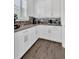 Bright kitchen with white cabinets, sleek countertops, and stainless steel microwave at 13232 Alderley Dr, Orlando, FL 32832