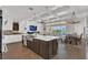 Gourmet kitchen open to living room with fireplace and breakfast table at 13232 Alderley Dr, Orlando, FL 32832