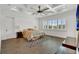 Serene main bedroom with tile floors, coffered ceilings, and plantation shutters at 13232 Alderley Dr, Orlando, FL 32832