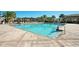 Sparkling community pool with ample seating and a well-maintained deck area, perfect for summer relaxation at 13232 Alderley Dr, Orlando, FL 32832