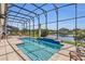 Relax in your backyard oasis with a sparkling pool, spa and tranquil water view at 13232 Alderley Dr, Orlando, FL 32832