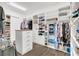 Spacious walk-in closet with custom shelving, drawers, and hanging rods for organized storage at 13232 Alderley Dr, Orlando, FL 32832