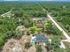 Aerial view of the property including fenced yard, pool, shed and surrounding greenery at 13735 Sw 73Rd St, Ocala, FL 34481