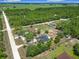 Aerial view of a property with swimming pool, fencing, and extensive landscaping at 13735 Sw 73Rd St, Ocala, FL 34481