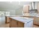 Well-designed kitchen with an island, ample counter space, and modern appliances, seamlessly flowing into the living area at 13735 Sw 73Rd St, Ocala, FL 34481
