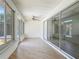 Enclosed sunroom featuring sliding glass doors and large windows for plenty of natural light at 13735 Sw 73Rd St, Ocala, FL 34481