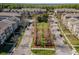 Aerial view of multi-Gathering residences in a neighborhood with green spaces and mature trees at 1400 Celebration Ave # 203, Celebration, FL 34747