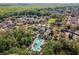 Aerial view of community amenities including pool and clubhouse surrounded by lush landscaping at 1400 Celebration Ave # 203, Celebration, FL 34747
