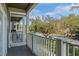 Balcony view of a neighborhood street featuring trees and other attractive residences at 1400 Celebration Ave # 203, Celebration, FL 34747