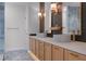 Luxury bathroom featuring dual sinks, custom cabinets, and modern fixtures at 1400 Celebration Ave # 203, Celebration, FL 34747